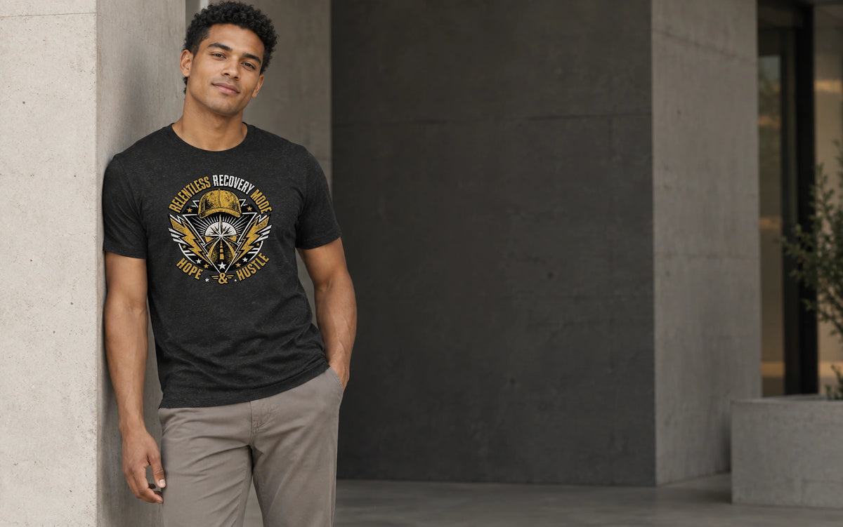 AI fashion mockup of a man wearing the black Relentless Recovery Mode graphic T-shirt by Recovery Merch in a shaded concrete architectural setting.