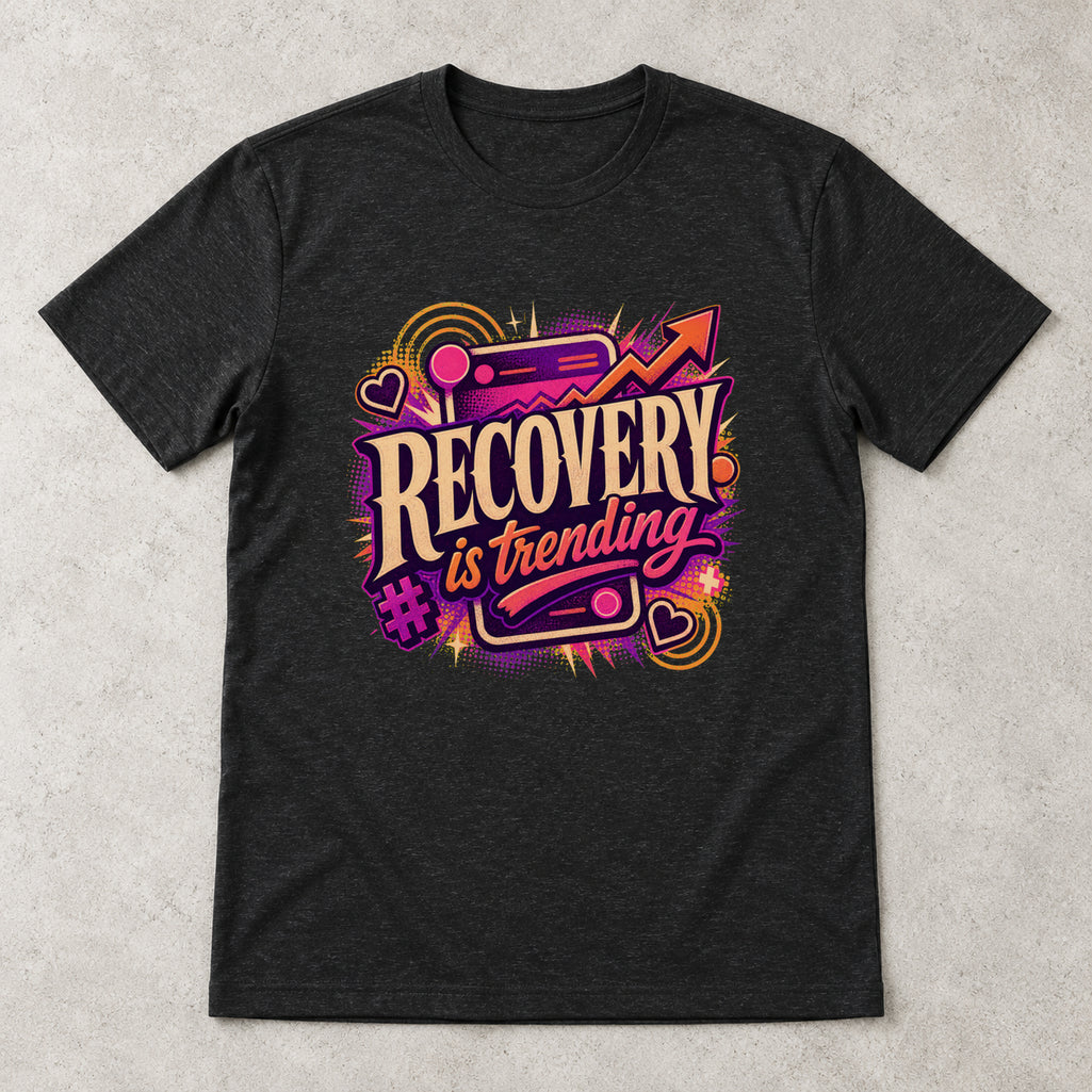 AI flat-lay mockup of the black Recovery Is Trending graphic T-shirt from Recovery Merch.